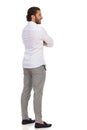 Rear Side View Of Elegant Man Standing With Arms Crossed And Looking Away Royalty Free Stock Photo