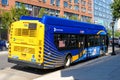 Rear side view of New York City Bus of Metropolitan Transportation Authority stopped on bus stop. - New York, USA - 2021 Royalty Free Stock Photo