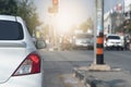 Rear side of white car stop at the intersection with turn on brake light. Royalty Free Stock Photo