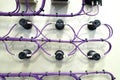 Rear socket of switch for electronic box with purple wire. Royalty Free Stock Photo