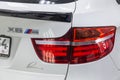 Rear taillight with lining view of luxury very expensive new white BMW X6 M Lumma CLR tuning car stands in the washing box waiting Royalty Free Stock Photo
