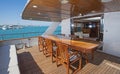 Table and chairs on rear deck of a luxury motor yacht Royalty Free Stock Photo