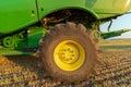 The rear tire on a John Deere S680 combine in a wheat field in Idaho, USA - July 29, 2021 Royalty Free Stock Photo