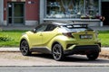 Rear of Toyota C-HR Hybrid crossover parked in the city