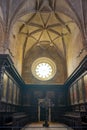 rear upper floor of the JerÃ³nimos church with rose window light Royalty Free Stock Photo