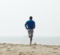 Rear view african american man jogging