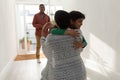 Mother embracing her son near doorway Royalty Free Stock Photo