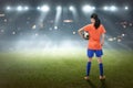 Rear view of asian female footballer with the ball Royalty Free Stock Photo