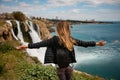 rear view of attractive woman on background of Duden waterfall in Antalya,Turkey. Royalty Free Stock Photo