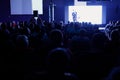 Rear view of Audience in the conference hall or seminar meeting which have Speakers on the stage, business and education Royalty Free Stock Photo