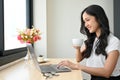 Rear view, Beautiful Asian businesswoman or female freelancer using laptop computer Royalty Free Stock Photo