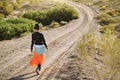 Rear view of asian woman walking in gobi desert Royalty Free Stock Photo