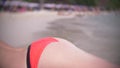 Rear view beautiful young girl at the beach back . wearing red bikini tropical vacation . close up . Royalty Free Stock Photo