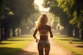 Rear view of a beautiful young woman running in the park, woman running in the park view from behind, AI Generated Royalty Free Stock Photo