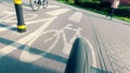 Rear view of a bicycle moving fast along city bike road Royalty Free Stock Photo