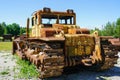 Rear view of big rusty old huge heavy crawler bulldozer, abandoned vintage earthmover dozer