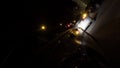 Rear view of a black car parked at night in the town street, night traffic concept. Footage. Passenger vehicle with neon