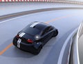 Rear view of black electric sports car driving on the highway