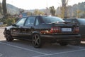 Rear view of a black Volvo 850 T-5R on the street