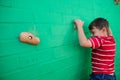 Rear view of boy climbing wall at playground Royalty Free Stock Photo