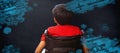 Composite image of rear view of boy sitting in wheelchair Royalty Free Stock Photo