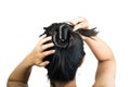 Rear view of brunette girl making hair bun Royalty Free Stock Photo