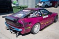 Rear view of the bumps and scratches of a purple Nissan Silvia S13 Sileighty