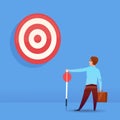 Rear view businessman holding arrow target business success concept on blue background flat Royalty Free Stock Photo