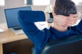 Rear view of businessman relaxing in a swivel chair Royalty Free Stock Photo