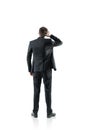 Rear view businessman scratching head, isolated Royalty Free Stock Photo