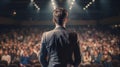 Rear view of businessman standing in front of audience in conference hall Generative AI Royalty Free Stock Photo