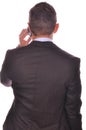 Rear view of businessman talking on his smartphone Royalty Free Stock Photo