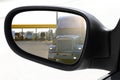 Rear view car driving mirror overtaking big truck Royalty Free Stock Photo