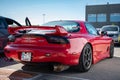 Rear view of a classic red Japanese Mazda RX-7 sports car