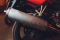 rear view of classical motorcycle pair of exhaust chrome pipes selective focus.