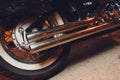 rear view of classical motorcycle pair of exhaust chrome pipes selective focus.