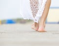 Rear view close up female walking barefoot