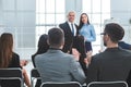 Rear view. company employees applauding at a work meeting