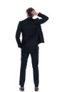 Rear view confused businessman scratching his head Royalty Free Stock Photo