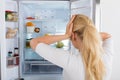 Woman Looking Inside The Fridge Royalty Free Stock Photo