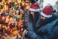 Rear view of couple on christmas market looking at decorative to Royalty Free Stock Photo