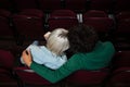 Couple having popcorn while watching movie in theatre Royalty Free Stock Photo