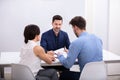 Couple Sitting In Front Of Judge Royalty Free Stock Photo