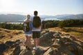 Rear View Of Couple Standing At Top Of Hill On Hike Through Countryside In Lake District UK Royalty Free Stock Photo
