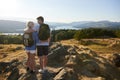 Rear View Of Couple Standing At Top Of Hill On Hike Through Countryside In Lake District UK Royalty Free Stock Photo
