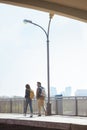 rear view of couple of tourists going at outdoor subway