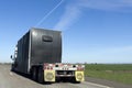 Rear view of covered semi under blue sky Royalty Free Stock Photo