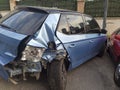 Rear view of a crashed blue hatchback car at street Royalty Free Stock Photo