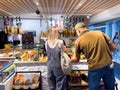 Rear view of customers buying shopping for traditional sausages in Palma Duty