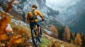 Rear view of a cyclist riding a mountain bike along a trail in a picturesque autumn forest with mountain peaks on the Royalty Free Stock Photo